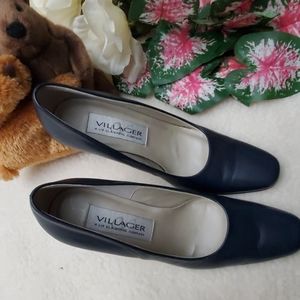 Slightly-worn high-heeled pumps